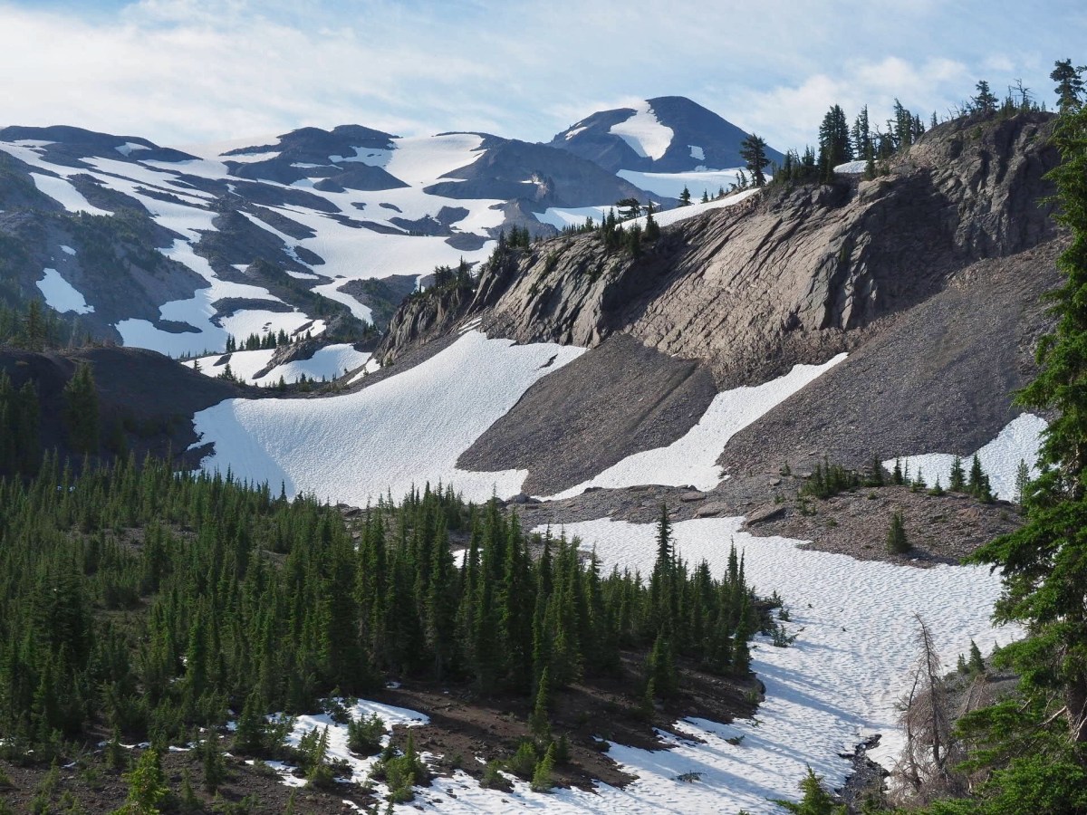 The Three Sisters mountains dominate the skyline 4,000 feet above the trial.